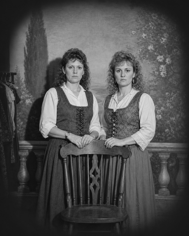 The Kessler Sisters behind one chair